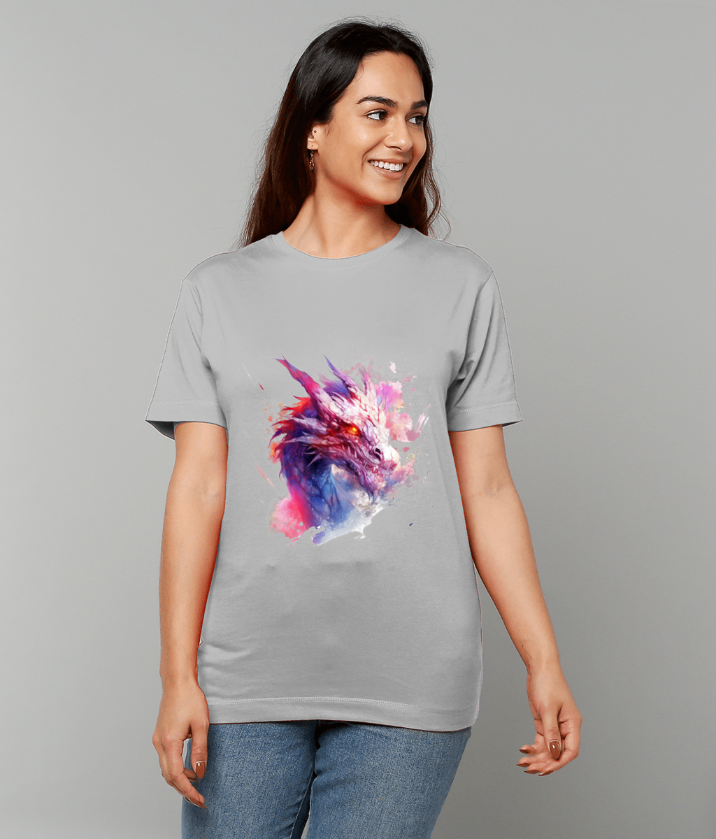 A smiling woman wearing a light gray T-shirt printed with a vibrant watercolor dragon head, standing against a plain gray background, hands relaxed at her sides.