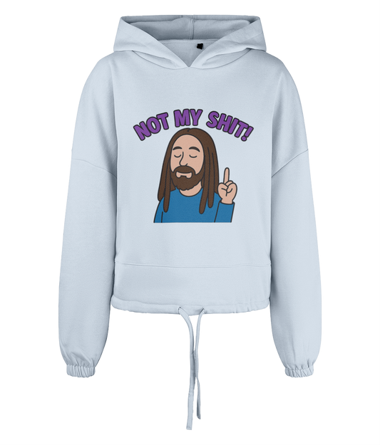 Light blue cropped hoodie displays a cartoon bearded man with dreadlocks raising one finger while eyes closed; purple text above reads "NOT MY SHIT!"; plain dark background.