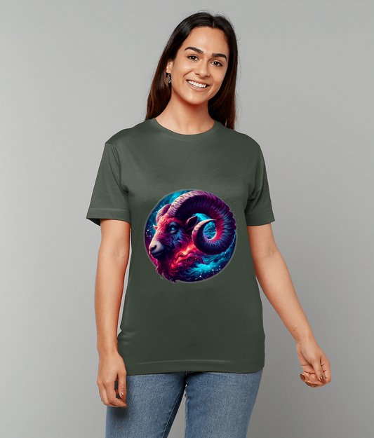 Colorful cosmic ram graphic displayed on the center of an olive-green T-shirt worn by a smiling person standing against a plain gray background paired with blue jeans.