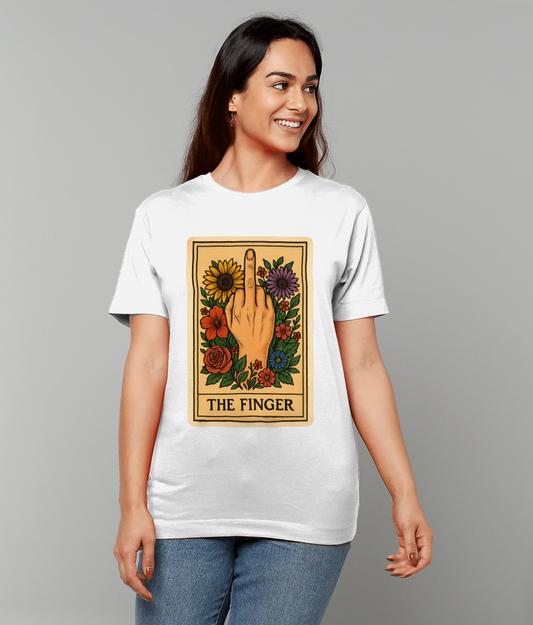 T-shirt graphic showing a hand with raised middle finger surrounded by colorful flowers, worn by a smiling woman standing against a plain gray background; text on shirt: "THE FINGER".