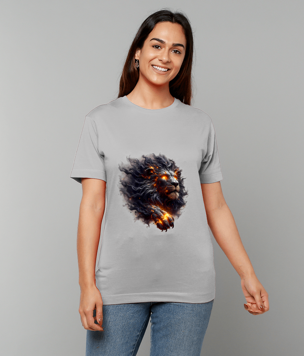 Lion graphic bursts with molten flames and glowing eyes printed on a light gray T-shirt worn by a smiling woman standing against a neutral gray studio background.