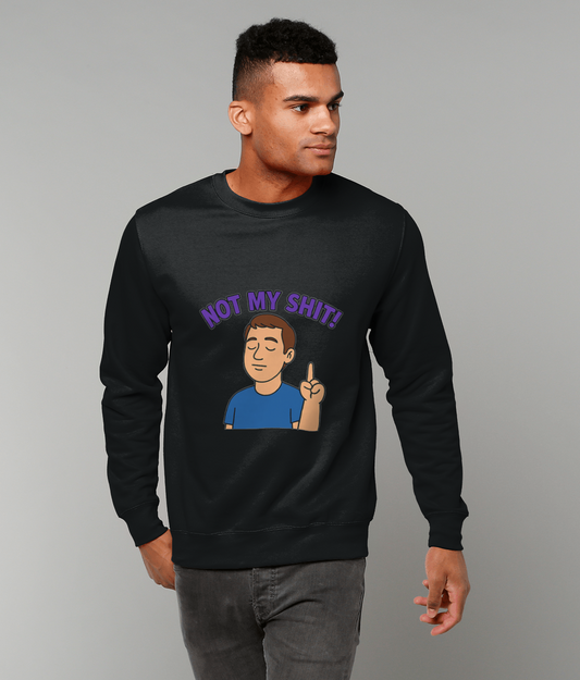 Person wearing a black sweatshirt printed with a cartoon of a calm figure raising one finger and the text 'NOT MY SHIT!' while standing against a plain light gray studio background.