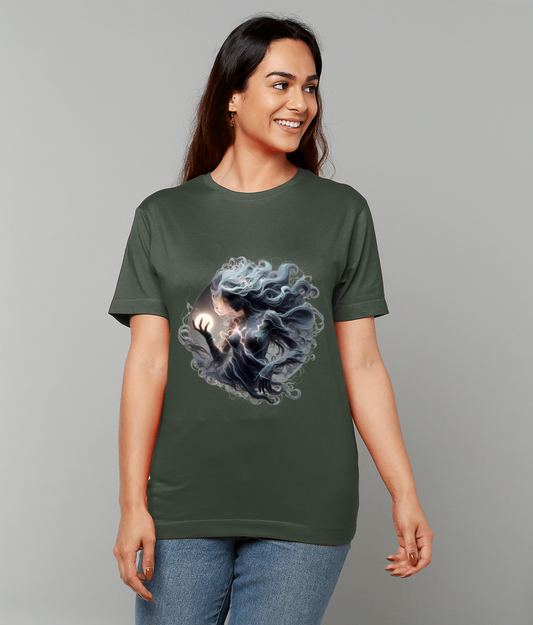T-shirt features a swirling ethereal figure with flowing hair clutching a glowing orb, centered on an olive green shirt worn by a smiling woman against a plain light gray background.