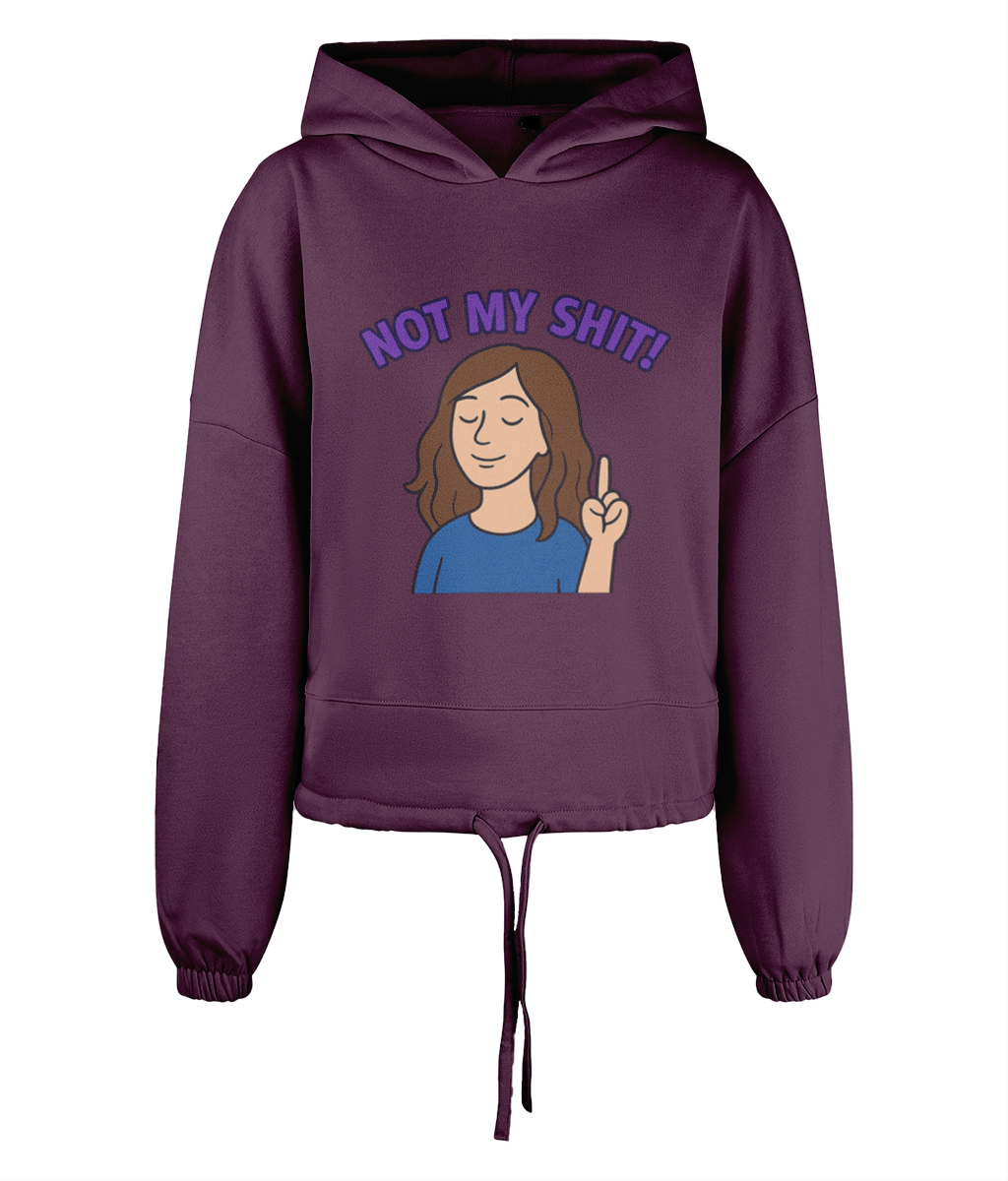 Hoodie displays a cartoon woman raising an index finger with a calm expression, text above reads "NOT MY SHIT!", centered on a plum-colored cropped drawstring hoodie against black background.