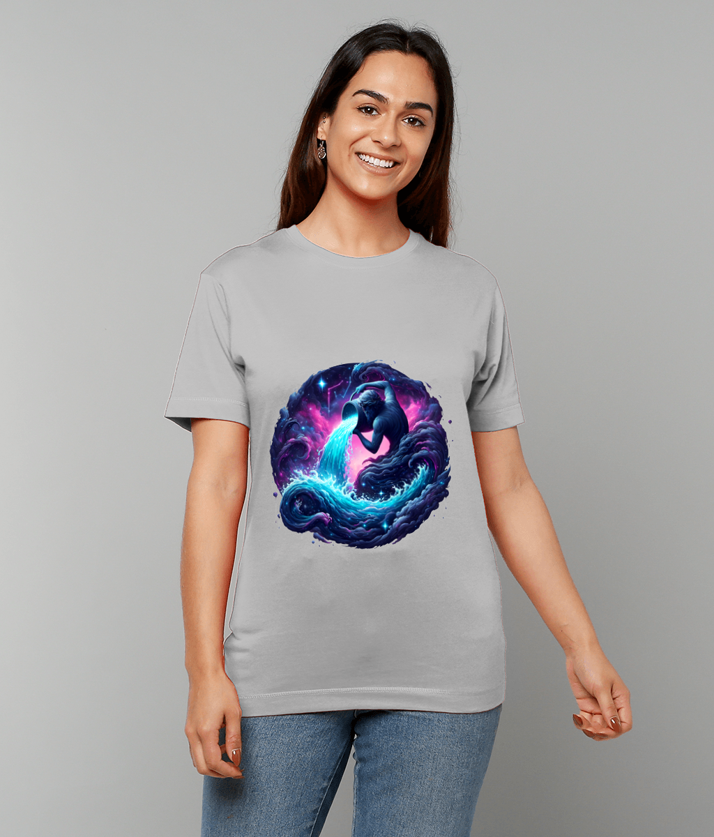 Light gray T-shirt displays a circular cosmic design of an elephant pouring a glowing blue water stream into swirling purple-blue nebula waves, worn by a person against a gray background.