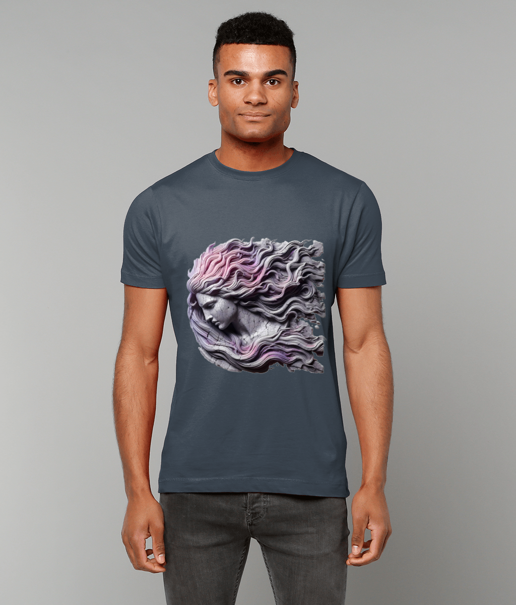 Stone-like female bust on a dark blue T-shirt, her cracked profile facing left as long pastel pink and purple hair ripples outward, worn by a standing man against a plain gray backdrop