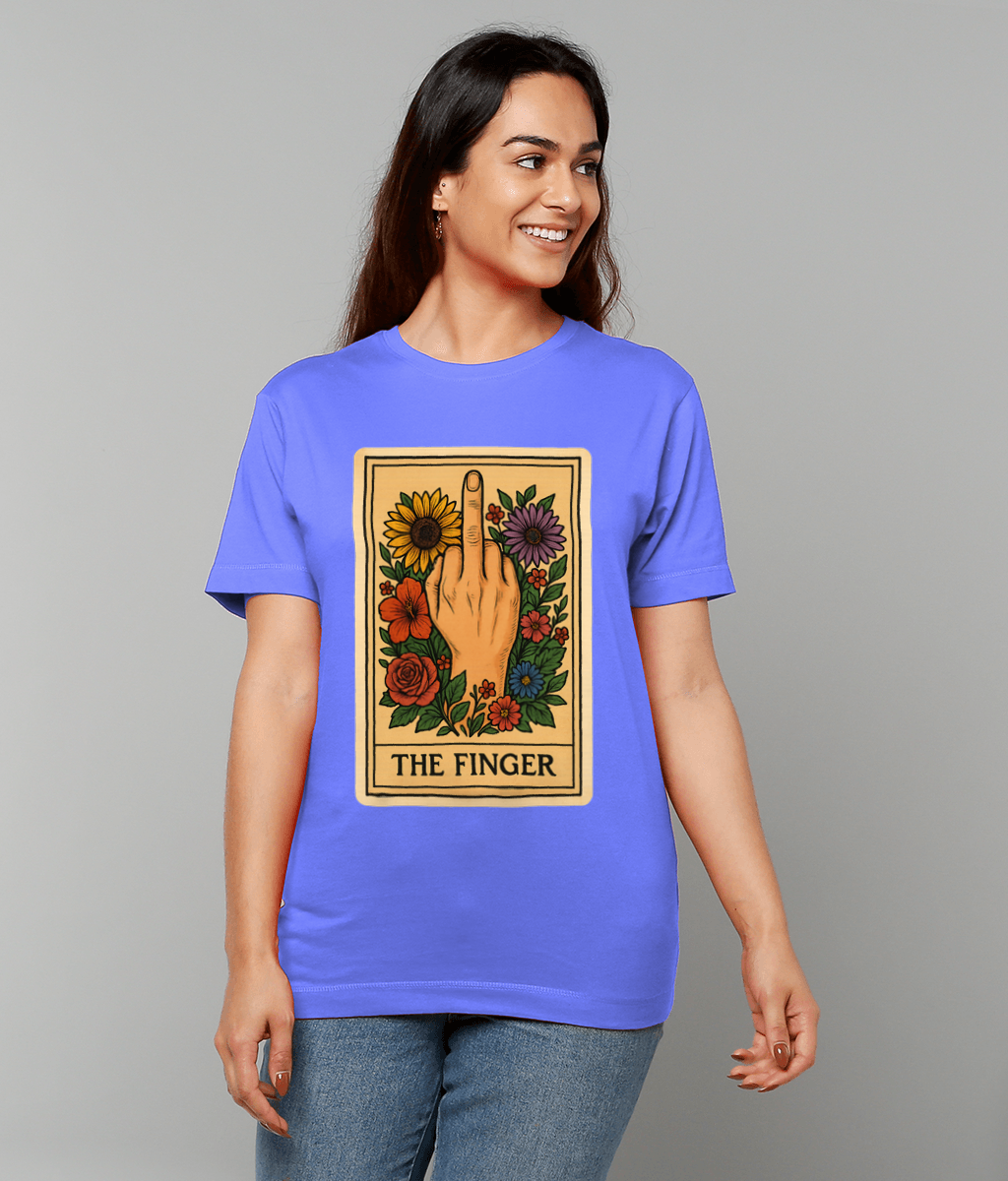 Card style illustration of a hand giving the middle finger surrounded by flowers printed on a blue T-shirt worn by a smiling person against a plain gray background; text: THE FINGER