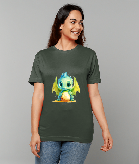 Green baby dragon graphic cradling a glowing egg on a dark green t-shirt worn by a smiling woman standing against a plain light gray background.