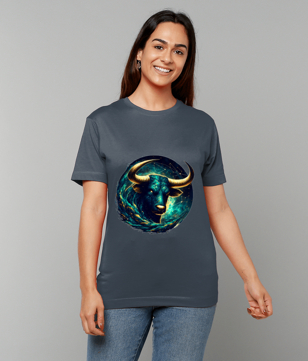 Large glowing bull illustration faces forward on a gray T-shirt worn by a smiling woman standing against a plain gray background, her hands relaxed at her sides.