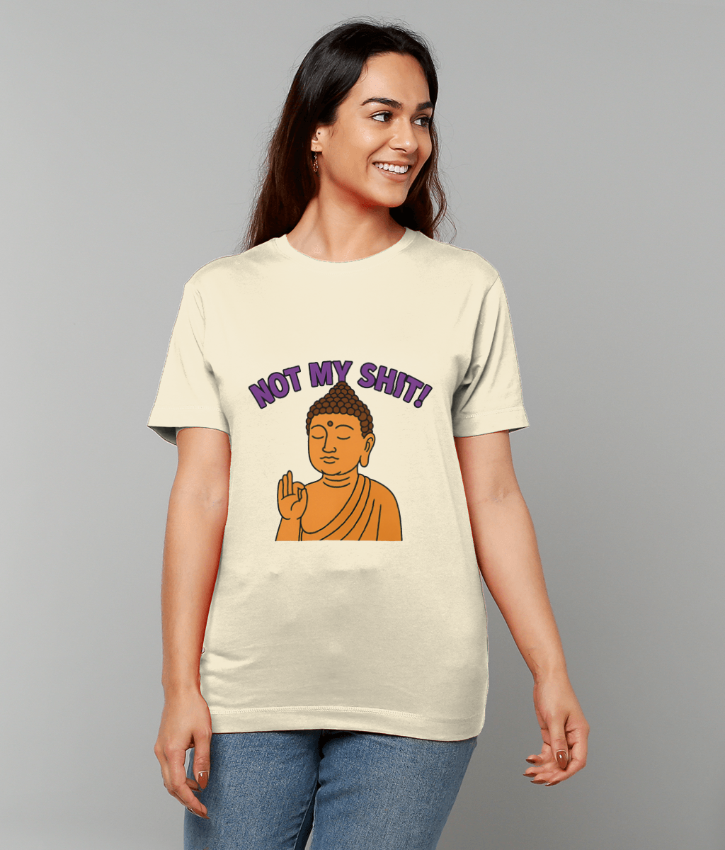 T-shirt displays a cartoon Buddha with hand raised in blessing gesture and the caption NOT MY SHIT! worn by a smiling person standing against a plain gray background.