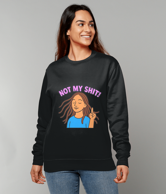 Black sweatshirt reading "NOT MY SHIT!" above a cartoon of a woman making a peace sign; worn by a smiling woman standing against a plain light gray background.