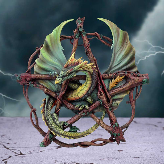 A green dragon rests within a pentacle of intertwined branches, forming a wall hanging; stormy sky backdrop.