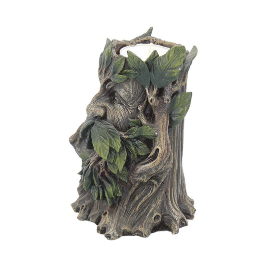 A carved tree-stump candle holder sculpted as a bearded Green Man face, its leaf beard partially covering the mouth and holding a white candle against a white background.