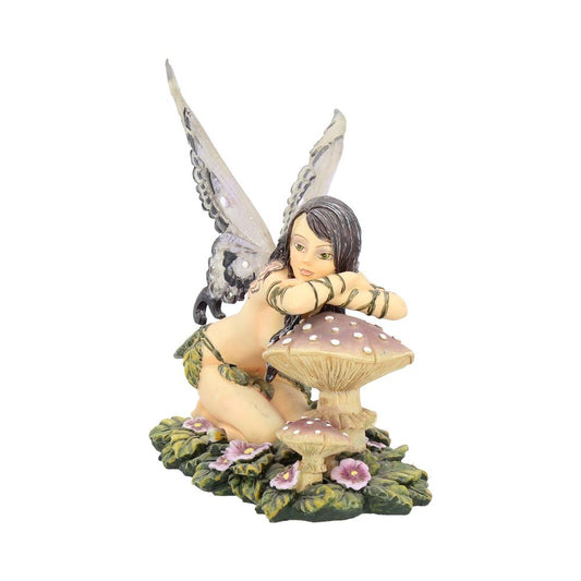 A winged fairy kneels, leaning on a spotted mushroom among greenery and purple flowers. The background is plain white.