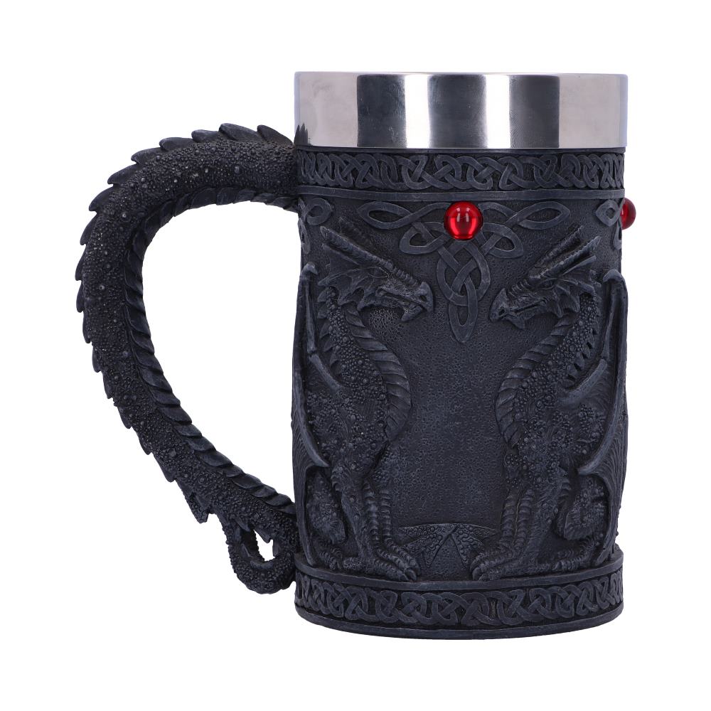 A gray sculpted mug features symmetrical dragons facing each other. The mug handle is shaped like a dragon tail. Red gems are on the mug, and the rim is metal.