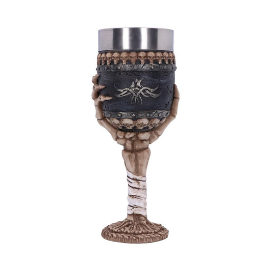 Skull-adorned goblet clasped by a detailed skeletal hand forming the stem, holding a black tumbler with metal rim and skull band, shown isolated on a plain white background.