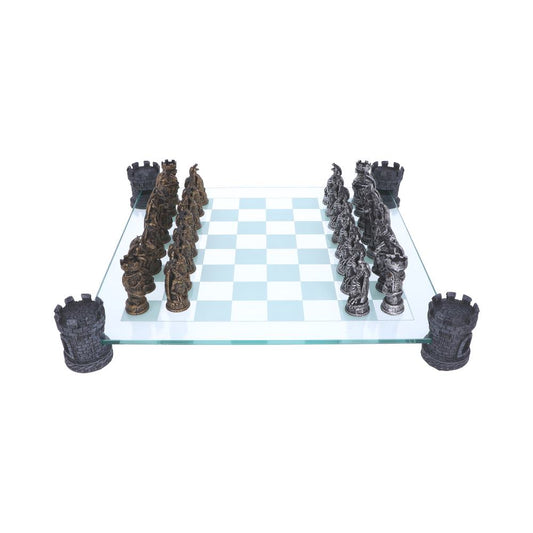 A glass chessboard, holding two armies of sculpted chess pieces, sits on a white background, supported by four castle-shaped supports at its corners.