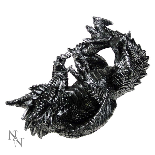 A metallic, black dragon figurine rests on its side, claws curled. It's isolated against a white background.