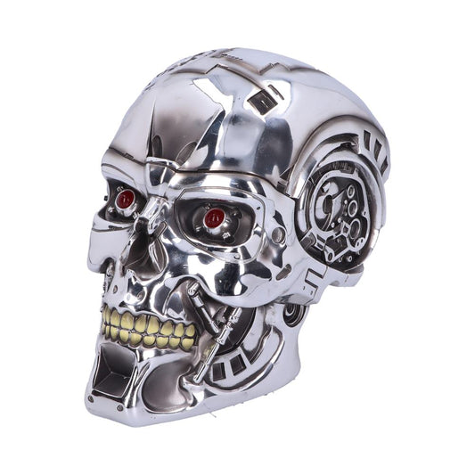 A shiny, metallic robotic skull with red eyes and visible mechanical components is positioned against a plain white background.