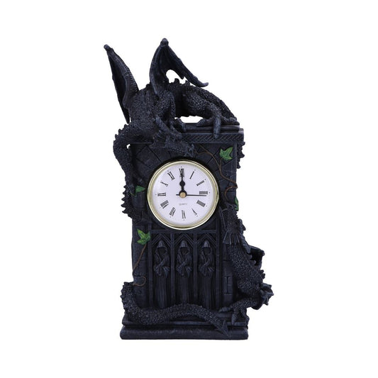 A black clock, shaped like a gothic tower, is adorned by dragons. The clock displays the time. It sits on a white background.