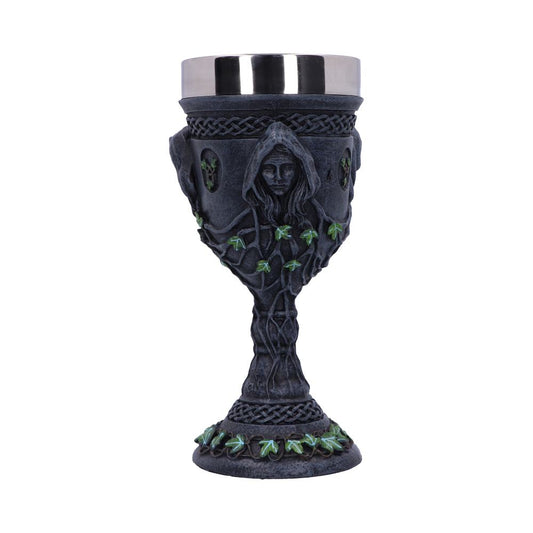 A pewter goblet, embellished with Celtic knots, a robed woman and green ivy designs, sits on a white background. The goblet's drinking area has a shiny silver rim.