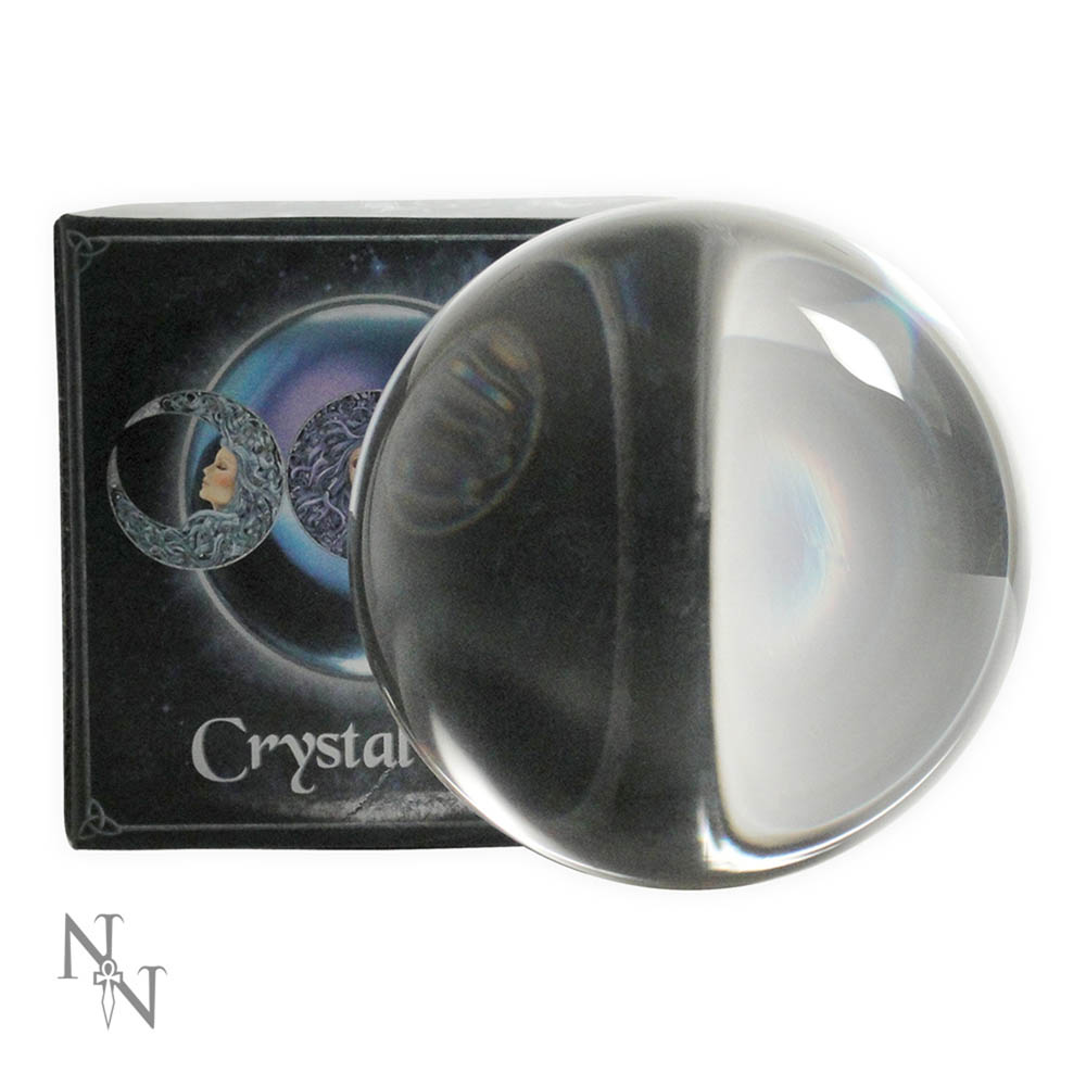 A clear crystal ball sits in front of its dark packaging, reflecting images on the box. The packaging says "Crystal".