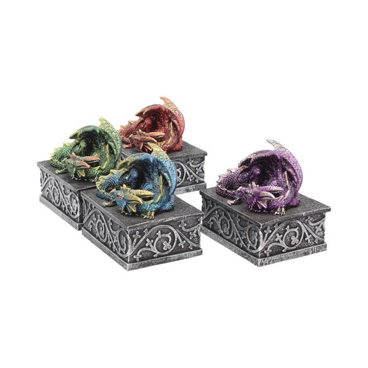 Four vibrantly colored dragon figurines—green, red, blue, and purple—rest on intricately carved gray boxes with swirling patterns, arranged in a neat formation against a white background.