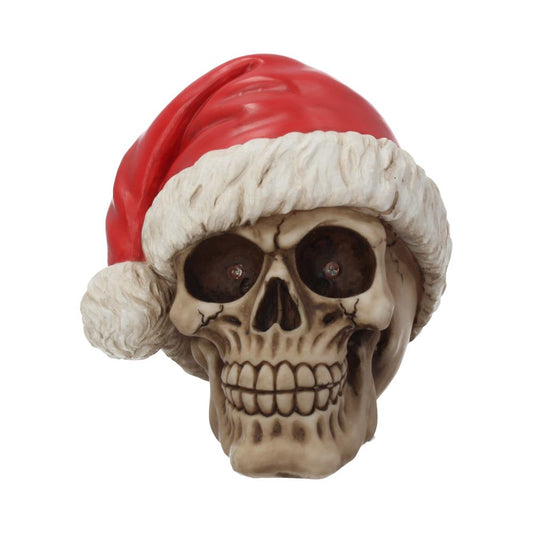 A skull wearing a Santa hat is centered, smiling with a festive expression. The red hat has white trim, contrasting with the skull's beige and brown tones.
