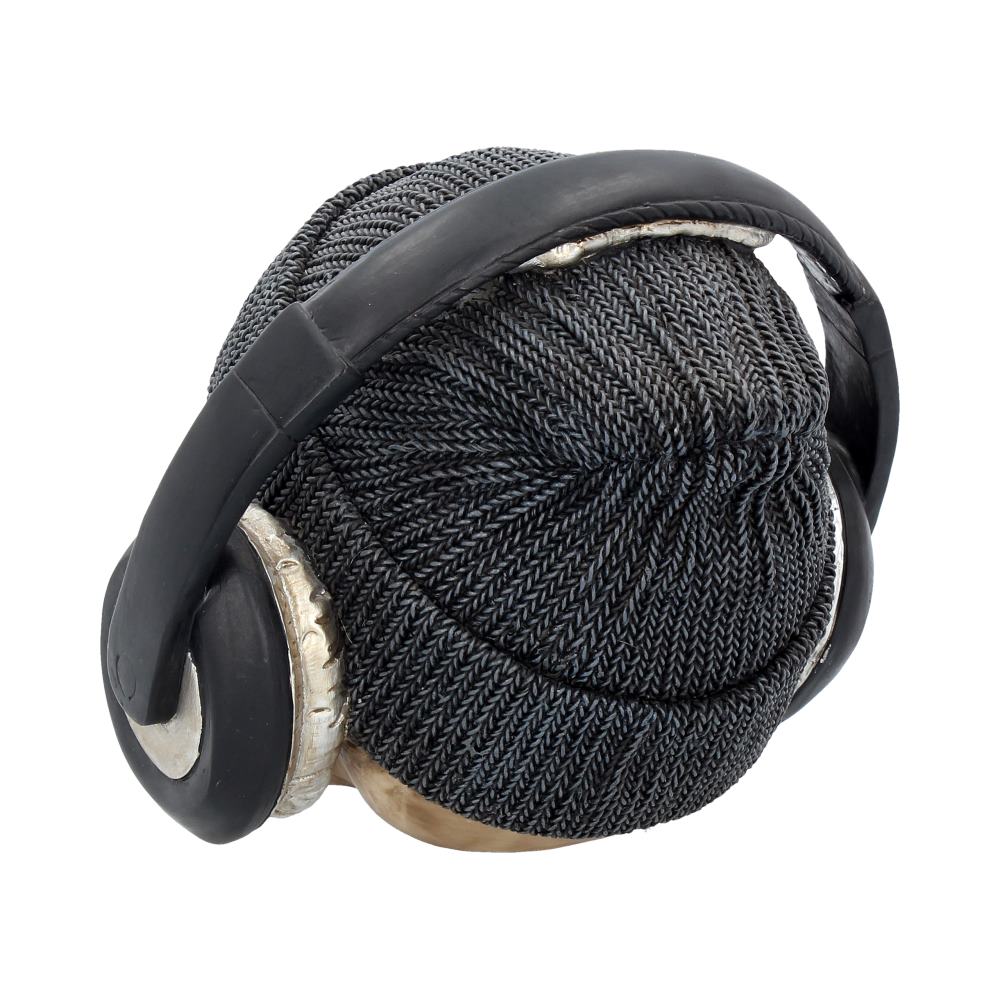 A sculpture resembling a knitted beanie with attached headphones. The textured pattern imitates yarn, and the context is a plain, white background.