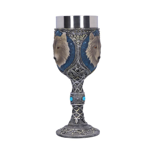 A decorative silver goblet features two wolf head busts against a blue backdrop. It has a silver cup, an ornate stem with turquoise accents, and a detailed, patterned base.