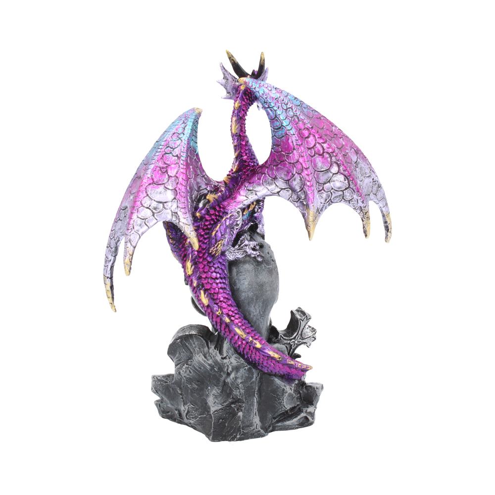 A vibrant dragon figurine with purple and pink scales wraps around a dark stone, spreading its iridescent wings upwards. The sculpture is isolated on a plain white background.