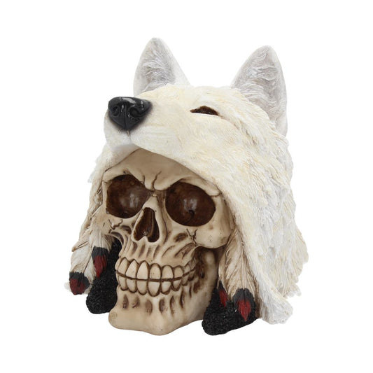 A human skull adorned with a white wolf headdress, featuring fur, ears, and decorative feathers, stands in a plain backdrop, giving it a mystical, ceremonial appearance.