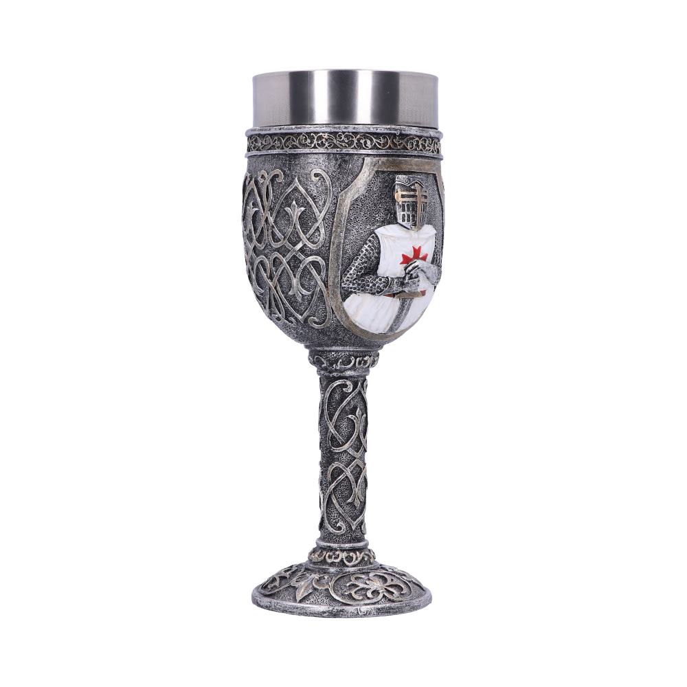 An ornamental metal goblet features a knight figure holding a sword on its textured, decorated body. The goblet sits on a patterned base in a white space.