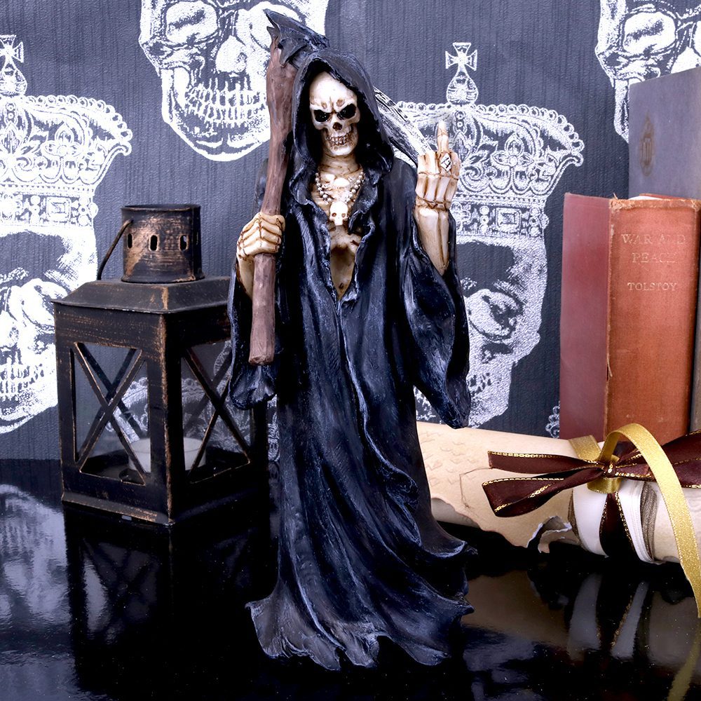 A skeleton in a black robe holds a staff, standing on a reflective surface. Nearby are a lantern, rolled parchment, and books, including "War and Peace" by Tolstoy. Background features skulls with crowns.