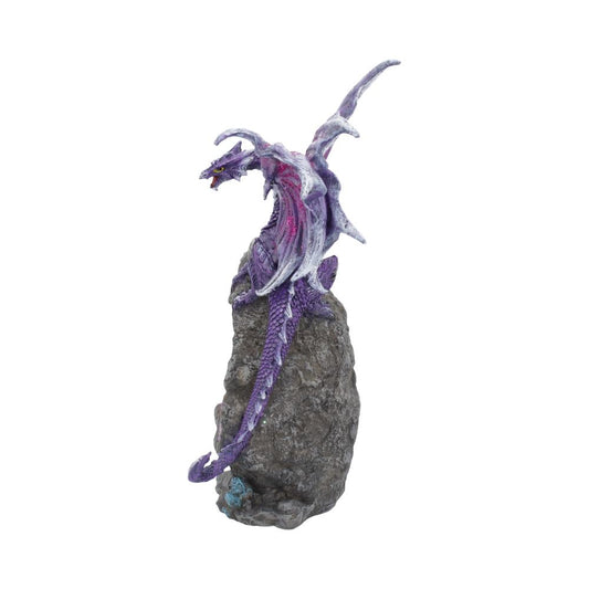 A purple and white dragon figurine perches on a rocky base, its wings spread and tail coiled, against a plain white background.