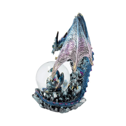 A blue dragon figurine, curled around a clear glass sphere containing a smaller dragon, rests on a rocky base.