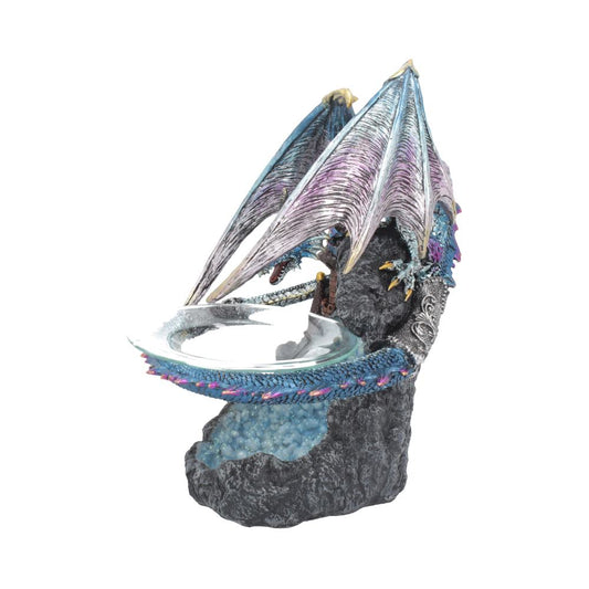 A blue dragon figurine supports a shallow glass bowl; it rests on a sculpted rock base.