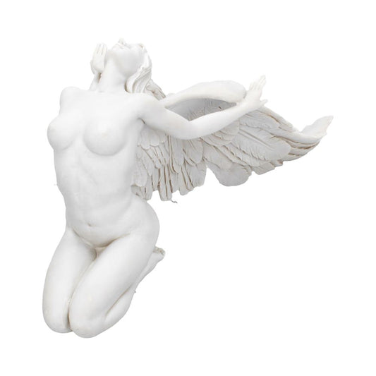 A white sculpture depicts a winged female figure kneeling, with her head tilted back and arms raised, suggesting flight or reverence, against a plain background.