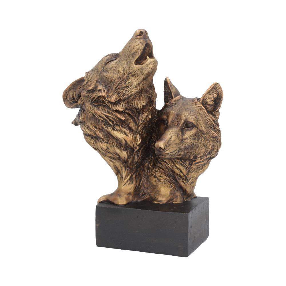 A bronze-colored sculpture features two wolves; one howling upwards and the other gazing forward. They are mounted on a rectangular black base, against a plain white background.