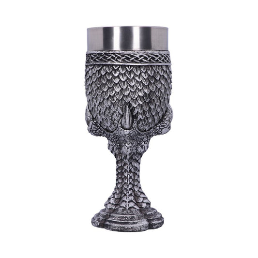 A silver, dragon-themed goblet stands on a white background. Its cup features scales and a braided design; the stem and base are textured to resemble a dragon's leg and foot.