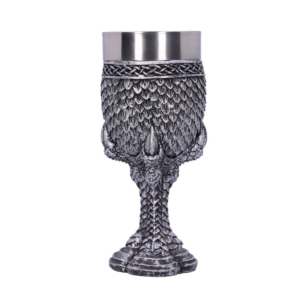 A silver-colored goblet, with a stainless-steel rim, features a dragon-scale design. The goblet's stem is formed to look like a dragon's claw with scales, all set against a plain white backdrop.