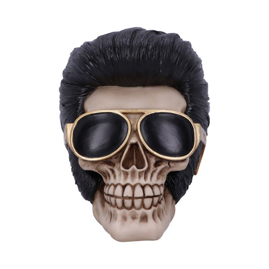 A skull wears black sunglasses and sports a styled, dark pompadour hairstyle, set against a plain white background.