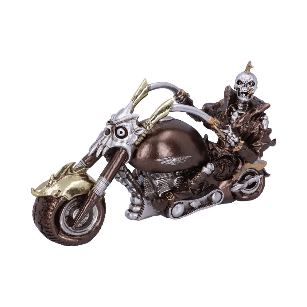 A skeleton figure rides a skeletal-themed motorcycle with a dark metallic finish and bone accents. The bike is detailed with intricate metalwork, evoking a gothic, macabre theme against a plain background.