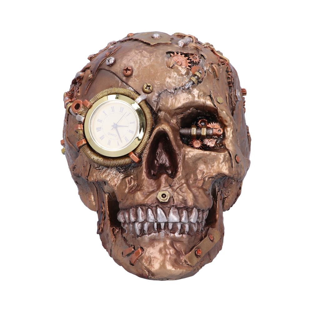 A metallic bronze skull, embedded with gears and a clock in one eye socket, rests against a white background, evoking a steampunk aesthetic.