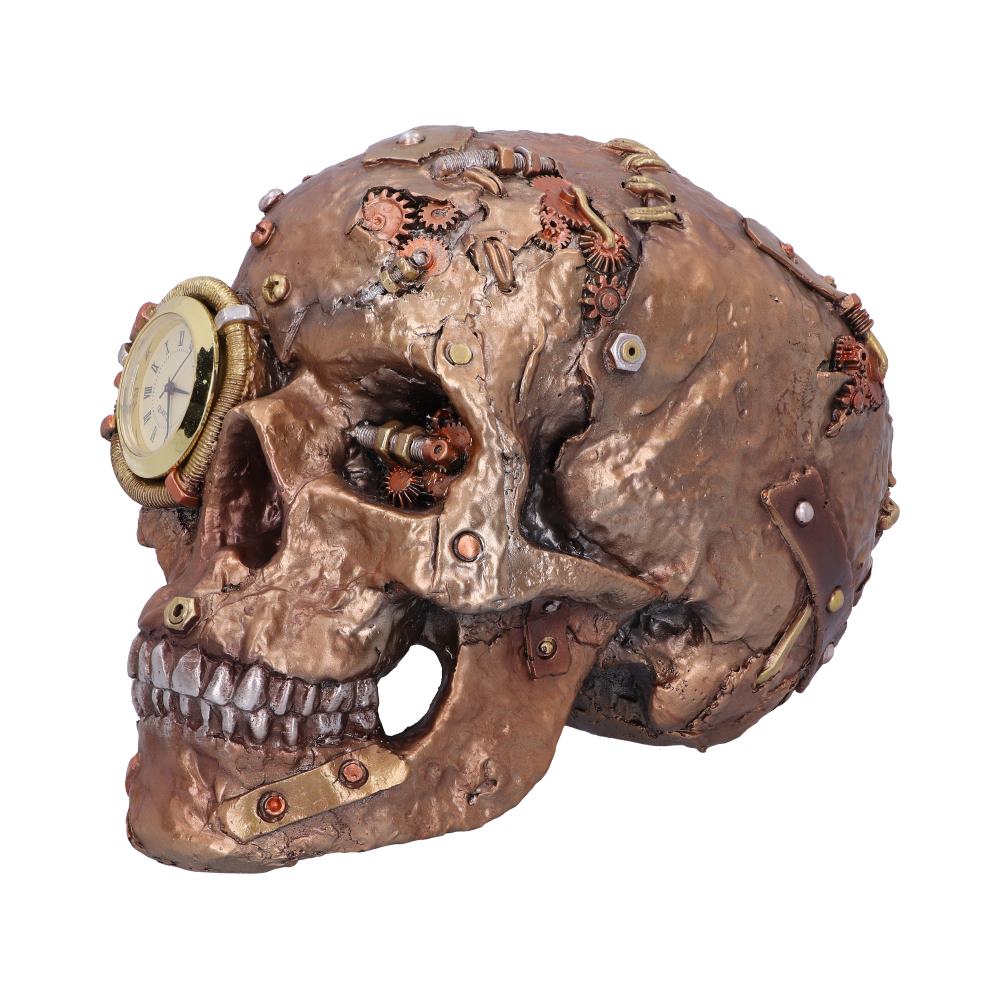 A bronze-colored skull is adorned with gears and mechanical components, featuring a clock on one eye socket, creating a steampunk aesthetic against a plain white background.