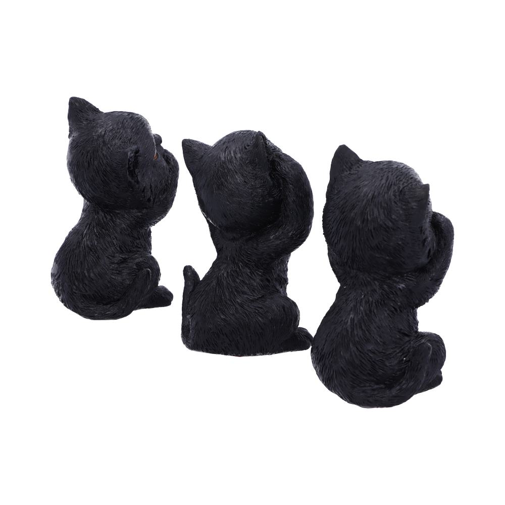 Three black cat figurines sit back-to-back, each with its own pose suggesting curiosity or playfulness, against a plain white background.