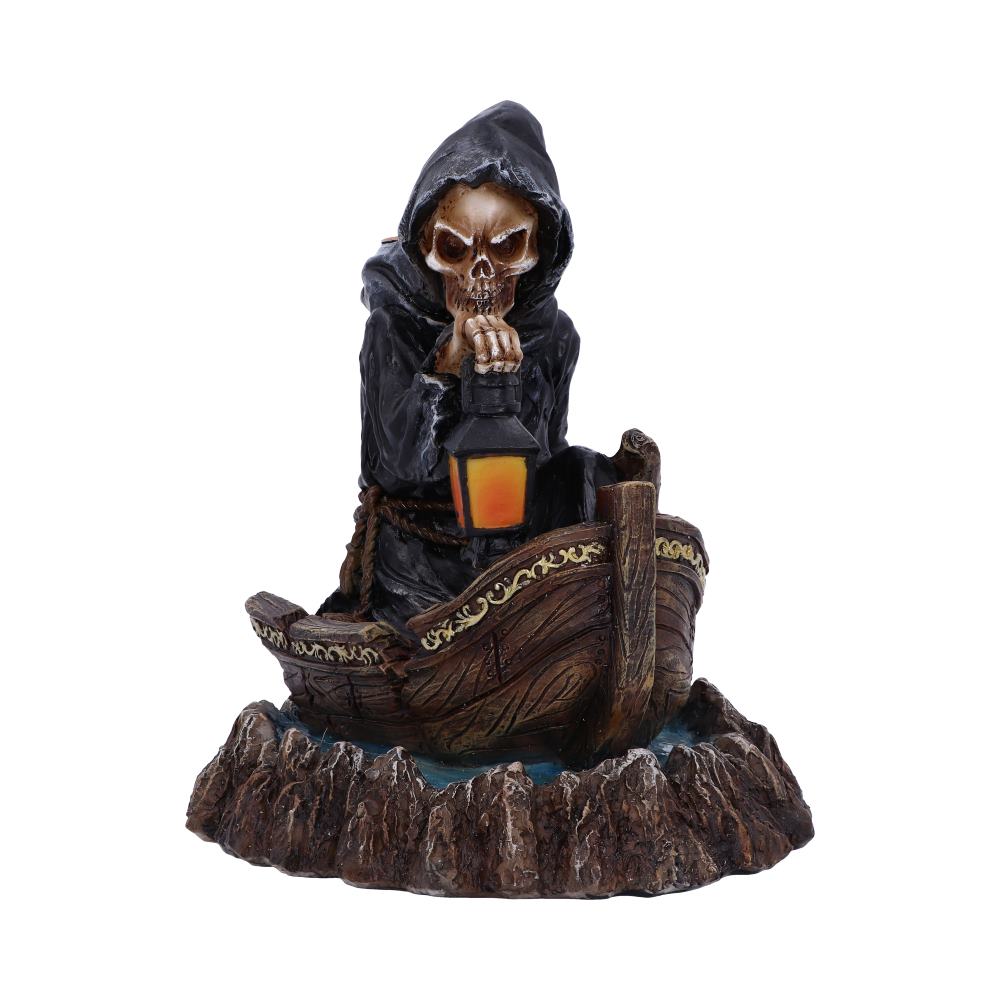 A skeletal figure in a hooded robe sits in a small boat, holding a lantern; it rests on a rocky base.