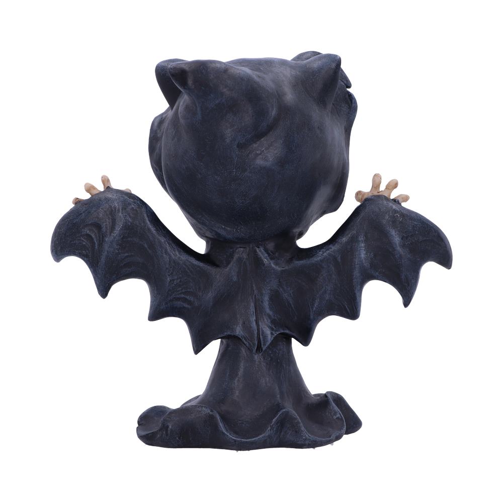 A small, cartoonish bat figurine stands with wings outstretched, facing away. Its dark body contrasts with neutral, slightly curved hands. The background is plain white.