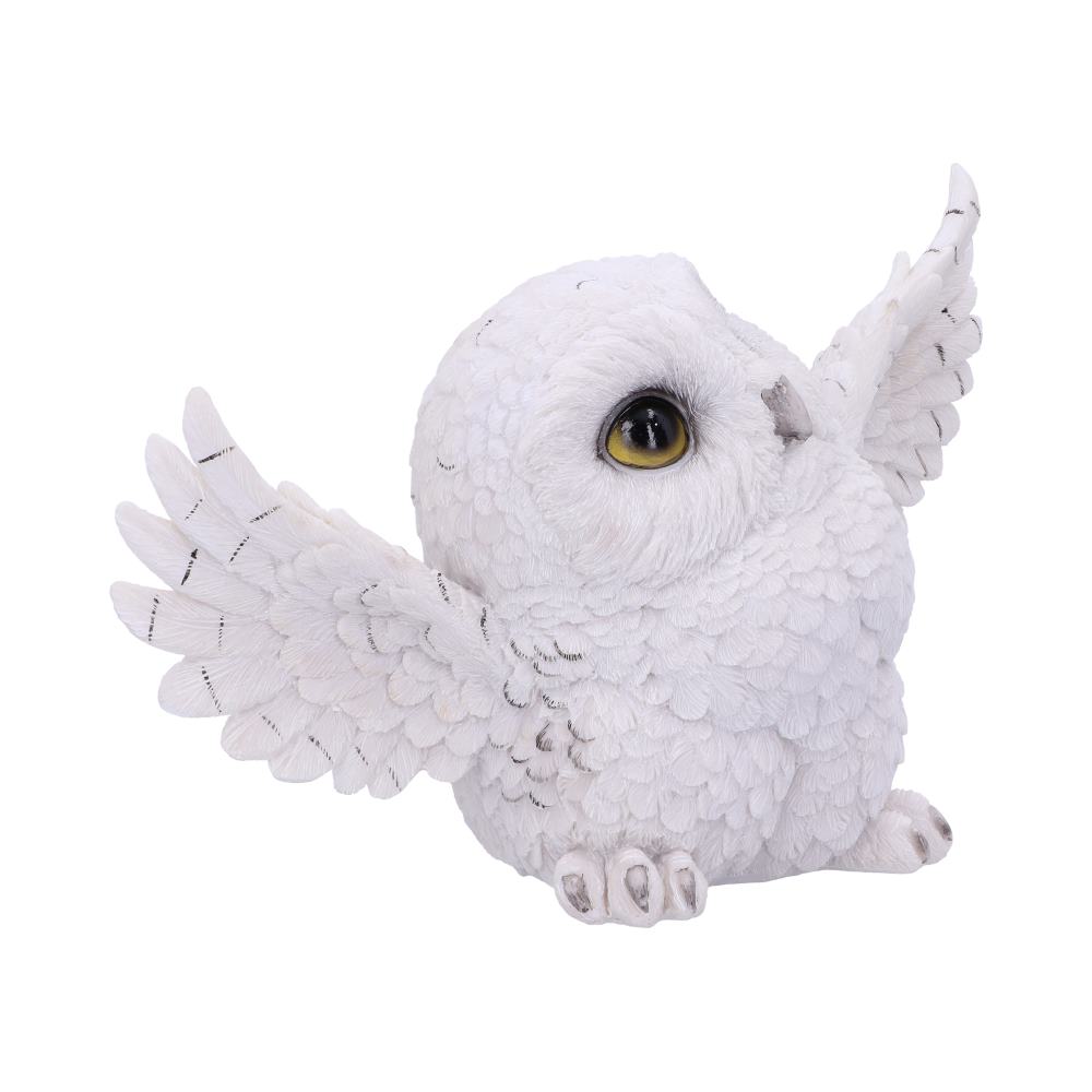 A white, fluffy owl figurine with large yellow eyes and raised wings, sitting upright against a plain white background.