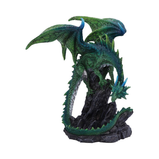 A green dragon figurine, with wings spread and head pointing downward, perches on a rocky formation. Vibrant scales and spiky details enhance its mythical appearance against a plain background.